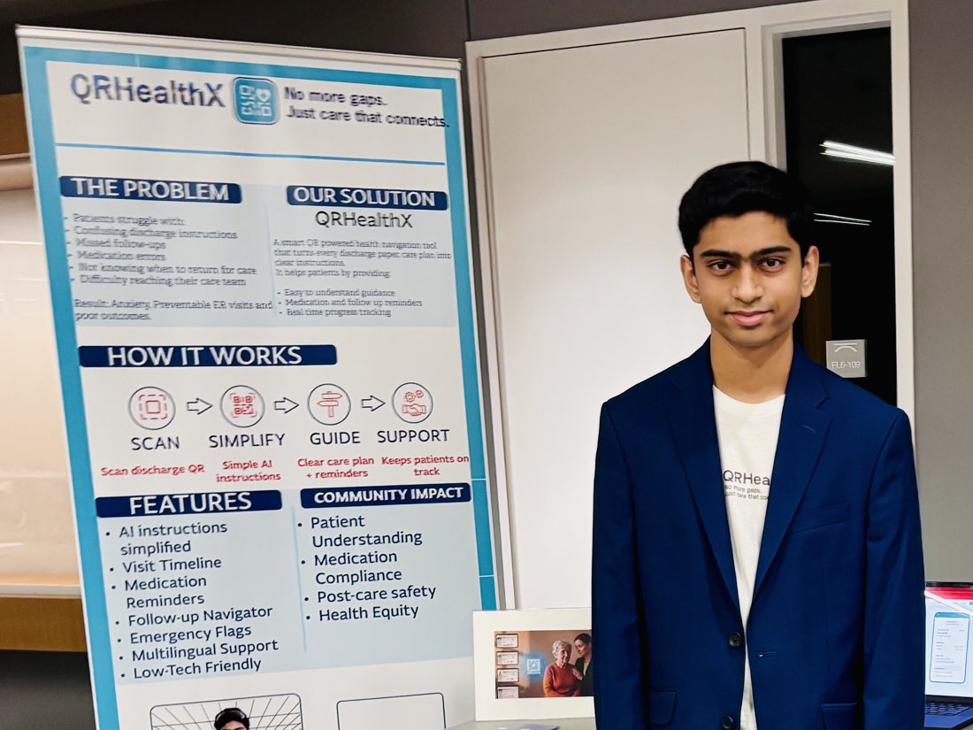 Ayushmaan Bellum presenting QRHealthX at an exhibition, beside a banner explaining its scan, simplify, guide and support workflow